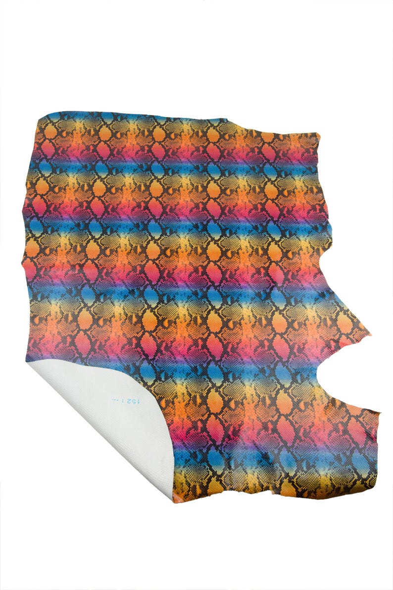 May include: A set of three ceramic canisters with lids, featuring a geometric pattern in shades of blue, white, and gray. The canisters vary in size, suitable for kitchen storage.