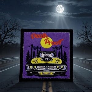 May include: Embroidered patch featuring a yellow muscle car with a large engine, set against a purple background with a yellow moon. The words "Death Proof" are arched above the car in orange script. The patch is framed in black.