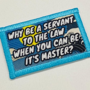 May include: A blue and white patch with the text "WHY BE A SERVANT TO THE LAW WHEN YOU CAN BE IT'S MASTER?" in white lettering.