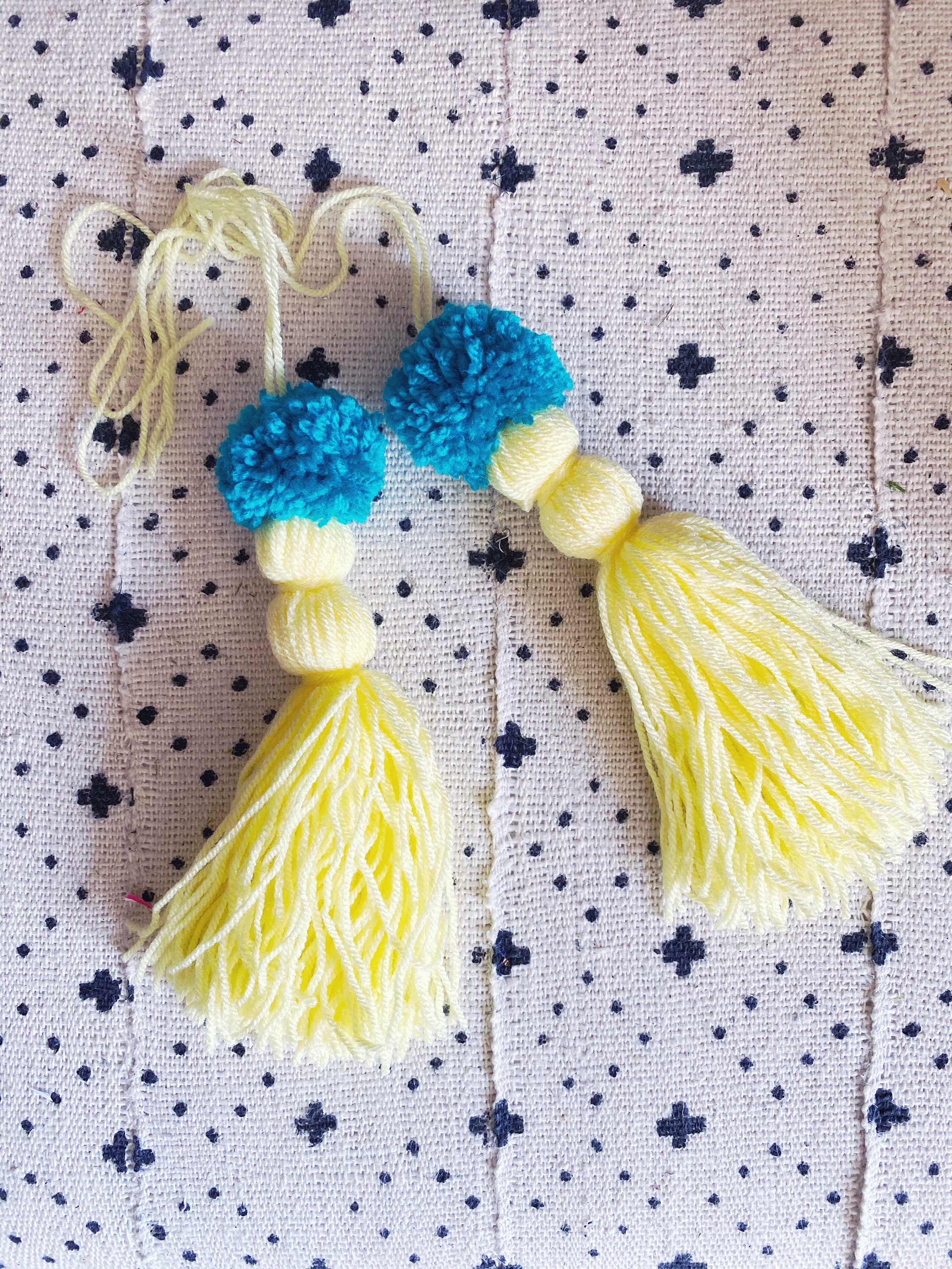 Set of two handlebar bicycle bike Pom Pom tassels.