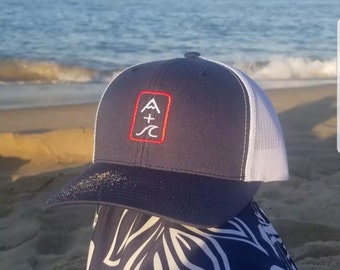Mountain & Wave Hat (navy/white mesh, vertical red logo)