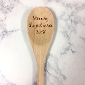 May include: A wooden spoon with the text "Stirring the pot since 2018" engraved on the front.