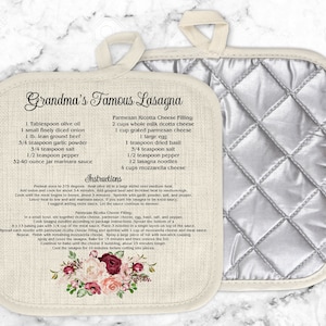 May include: A white linen pot holder with a recipe for Grandma's Famous Lasagna. The recipe includes ingredients for the lasagna and the ricotta cheese filling. The pot holder has a silver quilted back.