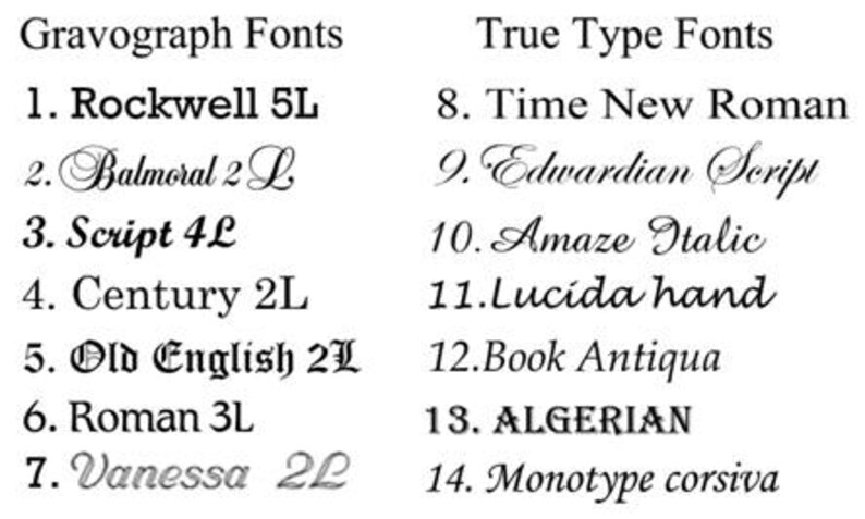 May include: A white background displays a list of font styles. The left column is labeled "Gravograph Fonts" and the right column is labeled "True Type Fonts". Each font is numbered and named, including Rockwell, Balmoral, Script, and Algerian.