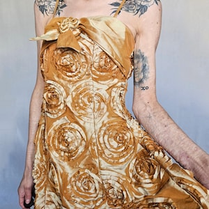 90s Gold Rosette Mini Dress – Bubble Hem & Bow Detail
