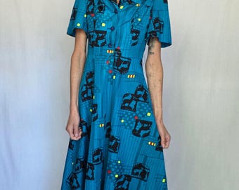 Vintage jaren 70-jurk: groenblauwe gedurfde grafische print - kraag, midi-lengte