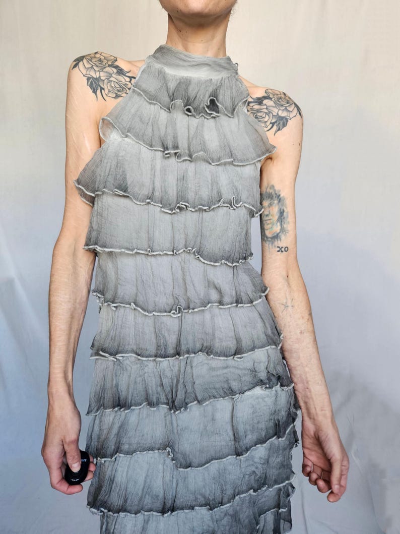 a woman with a tattoo on her arm