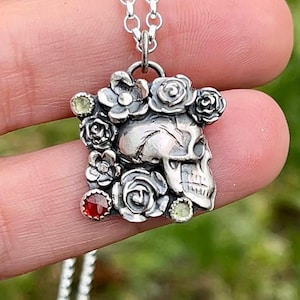 Sterling silver skull pendant with garnet and peridot, human skull pendant with flowers, romantic silver pendant