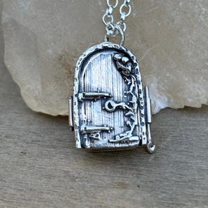 Sterling silver locket pendant with cat and moon inside, fairy door locket