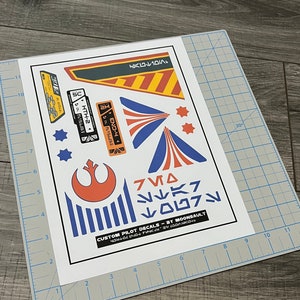 Star Wars STAR TOURS inspired X-wing Resistance Rebel Pilot Helmet Decal Set (scaled for Poe Black series helmet)