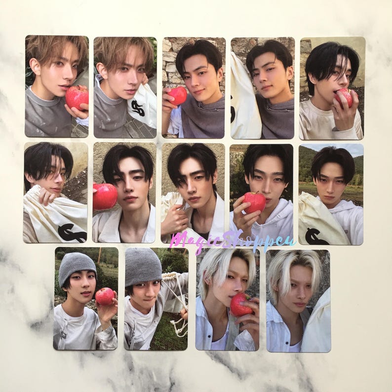 May include: A collection of rectangular photo cards featuring young men holding red apples. The cards have a light beige border and a soft focus background. The men are wearing various casual outfits.