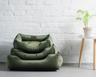 Cama para perros de terciopelo verde, espuma viscoelástica y funda extraíble.