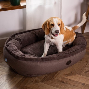 Cama para perros cómoda y redonda con forma de donut, ultra suave y lavable, base impermeable y lavable a máquina.