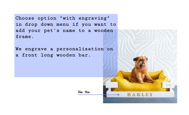 May include: A white wooden dog bed with a yellow cushion. The bed has a personalized nameplate that reads "HARLEY".