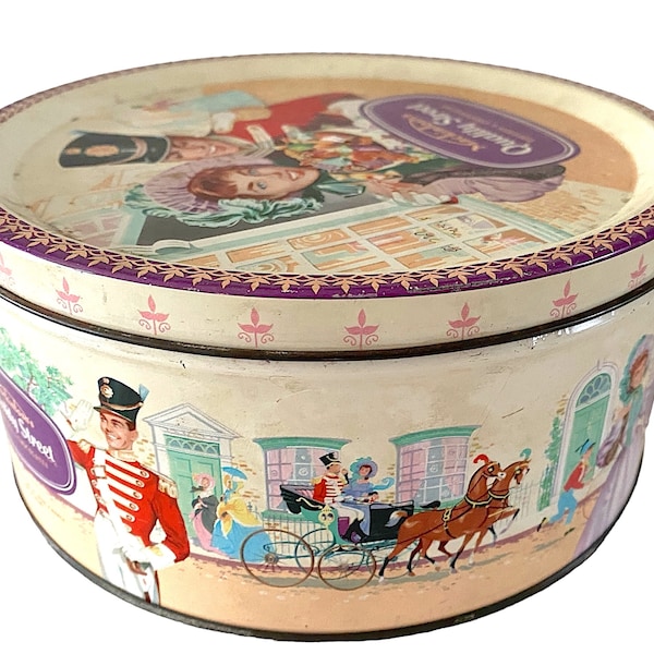 Boîte de conserve anglaise vintage des années 1950. Beau motif d'oeuvre d'art romantique édouardienne. Rose et pastels. Classique de la rue de qualité.