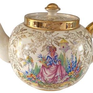 Tetera con tapa Sudlow. Dama en el jardín. Detalles dorados. Inglaterra, estilo vintage de los años 40.