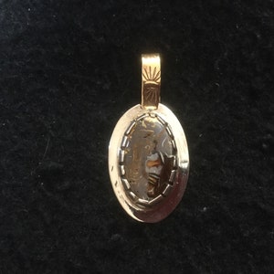 An Australian Boulder Opal Pendant set in Sterling Silver