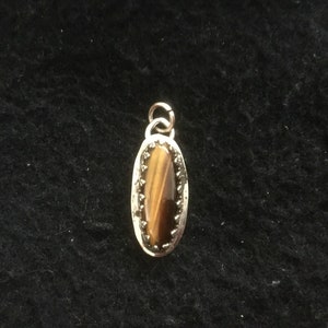 A Tiger Eye Stone Pendant set in Sterling Silver