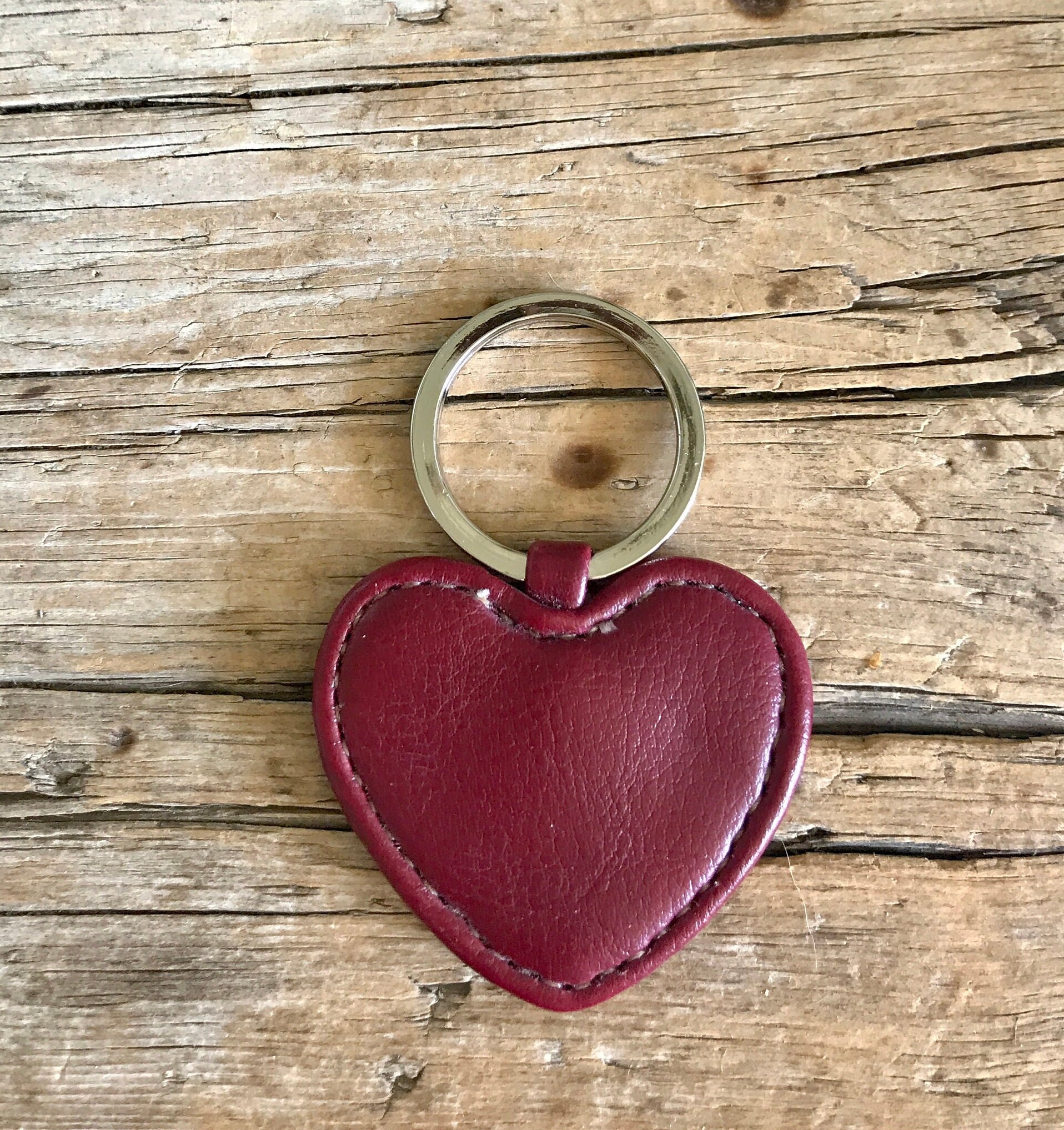 Heart shaped key chain made from Louis Vuitton canvas- red leather