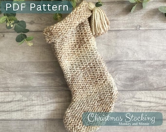 May include: A beige and cream speckled knit Christmas stocking featuring a folded cuff and a matching yarn tassel. The image includes the text PDF Pattern and Christmas Stocking Monkey and Minnie.
