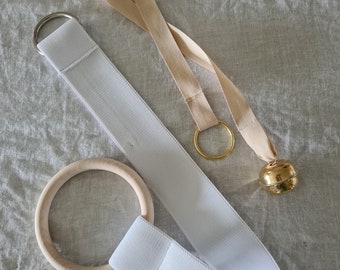 Montessori Tactile Mobiles.  Bell on ribbon. Big Wooden Ring on Elastic.