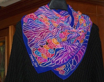Square, handpainted Silkscarf in orange, blue, red, pink and purple with unique pattern