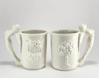 Pair White Angel Ceramic Mugs...Tree of Life...Doves in Wreath...McConnell Talus Corp.