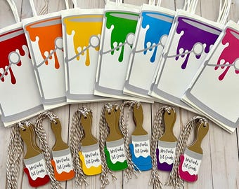 May include: A set of white paper gift bags featuring a colourful paint bucket graphic in red, orange, yellow, green, blue, purple, and pink. Each bag includes a matching paintbrush-shaped gift tag with the text Mrs. Parks 1st Grade.