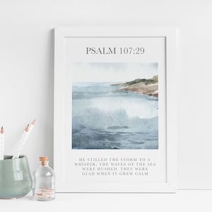 May include: A watercolour painting of a seascape with a quote from Psalm 107:29, "He stilled the storm to a whisper; the waves of the sea were hushed. They were glad when it grew calm."