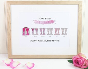 May include: A framed print with a watercolor illustration of a group of women wearing pink dresses and boots. The text "Sammy's Hens" and "Look out Marbella, here we come!" is printed below the illustration.