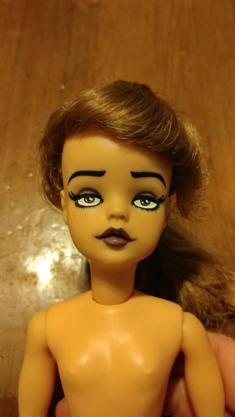 probably the 1964 Ideal Pos/'n Tammy Doll . Repainted Tammy Doll