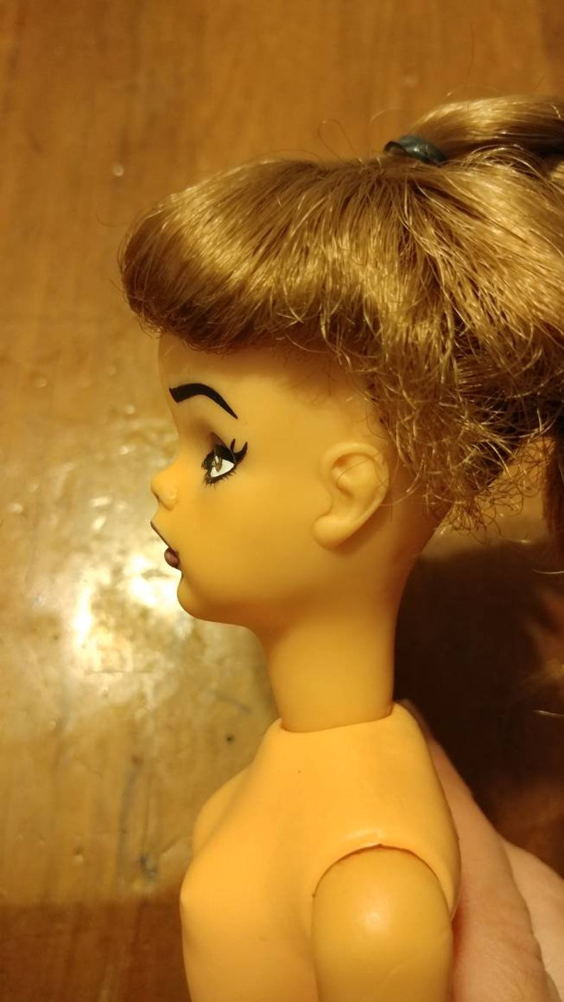 probably the 1964 Ideal Pos/'n Tammy Doll . Repainted Tammy Doll