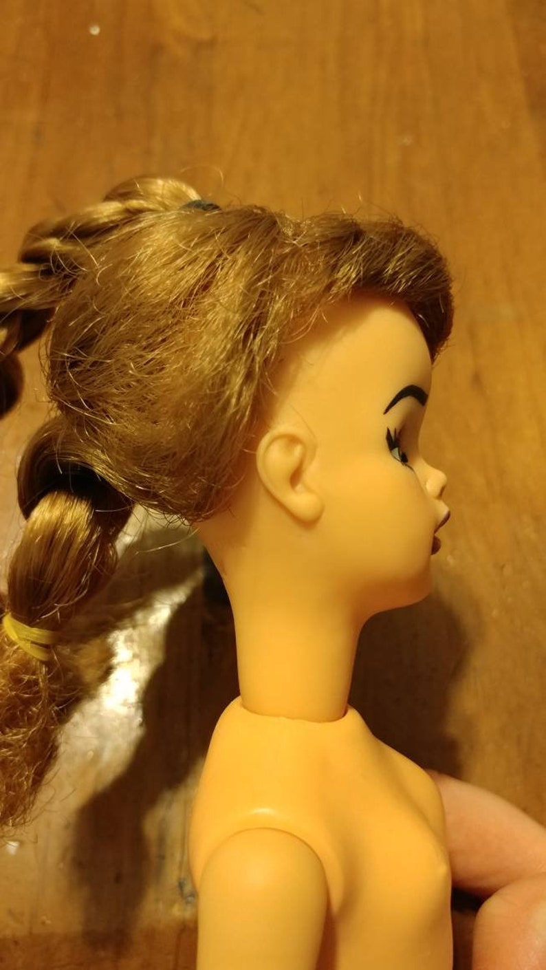 probably the 1964 Ideal Pos/'n Tammy Doll . Repainted Tammy Doll
