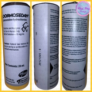 May include: A cylindrical container with the brand name "DORMOSEDAN" printed on it. The label includes text about the product's use for horses, dosage, and warnings. The container is yellow and white with black text.