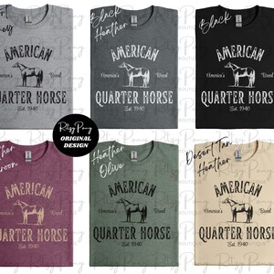 May include: A collection of t-shirts in various colors, including gray, black, maroon, olive, and tan. Each shirt features the text "AMERICAN QUARTER HORSE" with a horse illustration, and "America's Breed, Est. 1940."
