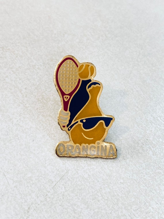 orangina vintage lapel Gem