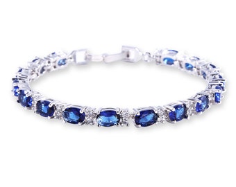 Or blanc rempli d'or blanc / Bracelet tennis saphir bleu