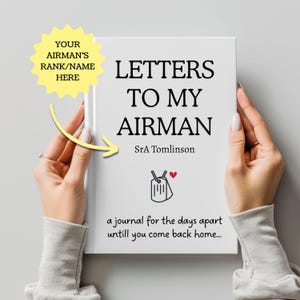 May include: A white journal titled "LETTERS TO MY AIRMAN" held by two hands. The cover includes the text "SrA Tomlinson" and a graphic of dog tags with a heart. A yellow starburst indicates where to add the airman's rank and name. The journal is a keepsake.