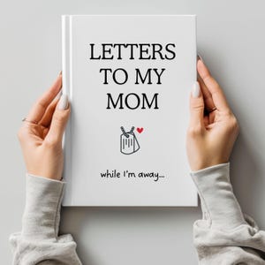 May include: A white journal with the text "Letters to my Mom while I'm away..." and a small black and white illustration of a dog tag with a heart.