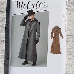 May include: McCall's sewing pattern for a long, double-breasted coat with a high collar. The pattern is for sizes 38-40-42-44. The pattern is shown on a model wearing the coat with a hat and gloves.