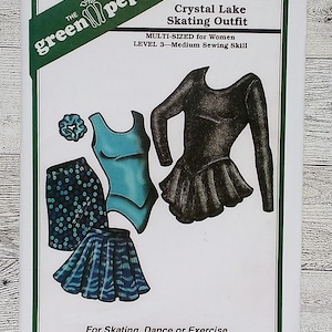 May include: A sewing pattern for a Crystal Lake Skating Outfit. The pattern includes a leotard, skirt, shorts, and scrunchie. The outfit is multi-sized and suitable for medium sewing skill level. The Green Pepper Inc. logo is visible.