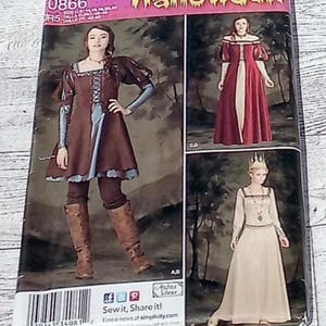 May include: Simplicity Halloween costume sewing pattern 0866. The pattern features three medieval-style costumes: a brown and blue dress with boots, a red gown with white accents, and a cream-colored dress with a crown.