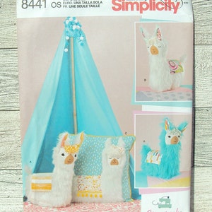 May include: A Simplicity sewing pattern for making a llama-themed play tent and pillows. The pattern includes instructions for making a blue tent, a white llama pillow with a yellow and orange design, a turquoise llama pillow with a yellow and orange design, and a white llama with a pink and orange design. The pattern number is 8441.