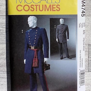 May include: McCall's Costumes pattern M4745. The pattern features a navy blue military-style uniform with gold buttons, a red sash, and black pants. The package includes a smaller image of a similar uniform. The text on the package reads "Costumes".