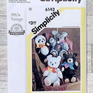 May include: Simplicity sewing pattern featuring teddy bears. The pattern is from the 1980s and includes instructions for making various stuffed animal bears. The package has the text "Simplicity" and "Authentic".