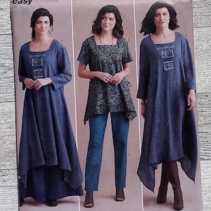 May include: Simplicity sewing pattern S8960 featuring three different dress designs. The pattern includes sizes 6-14. The cover shows women modeling the dresses. The text "easy-to-sew" is printed on the cover.