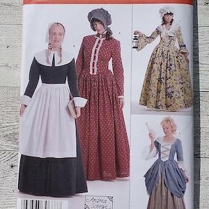 May include: Simplicity sewing pattern 3723 featuring historical costume designs. The pattern includes options for various dresses with bonnets and accessories. The size range is HH 6,8,10,12. The pattern is from Andrea Schewe.