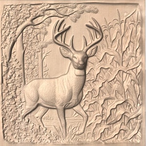 May include: A detailed relief carving of a deer in a forest setting. The artwork features a buck with large antlers, surrounded by trees and foliage. The carving is in a natural wood tone, showcasing the textures of the forest scene.