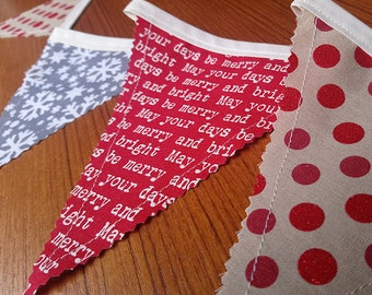 May include: A red fabric banner with white text that reads "your days be merry and bright May your days & days be merry and brie ry and bright May you r days be merry and br tht May your days be be merry and bri od bright May/yo s be merry and May your days merry and ight Ma merry our". The banner is decorated with white snowflakes and red polka dots.