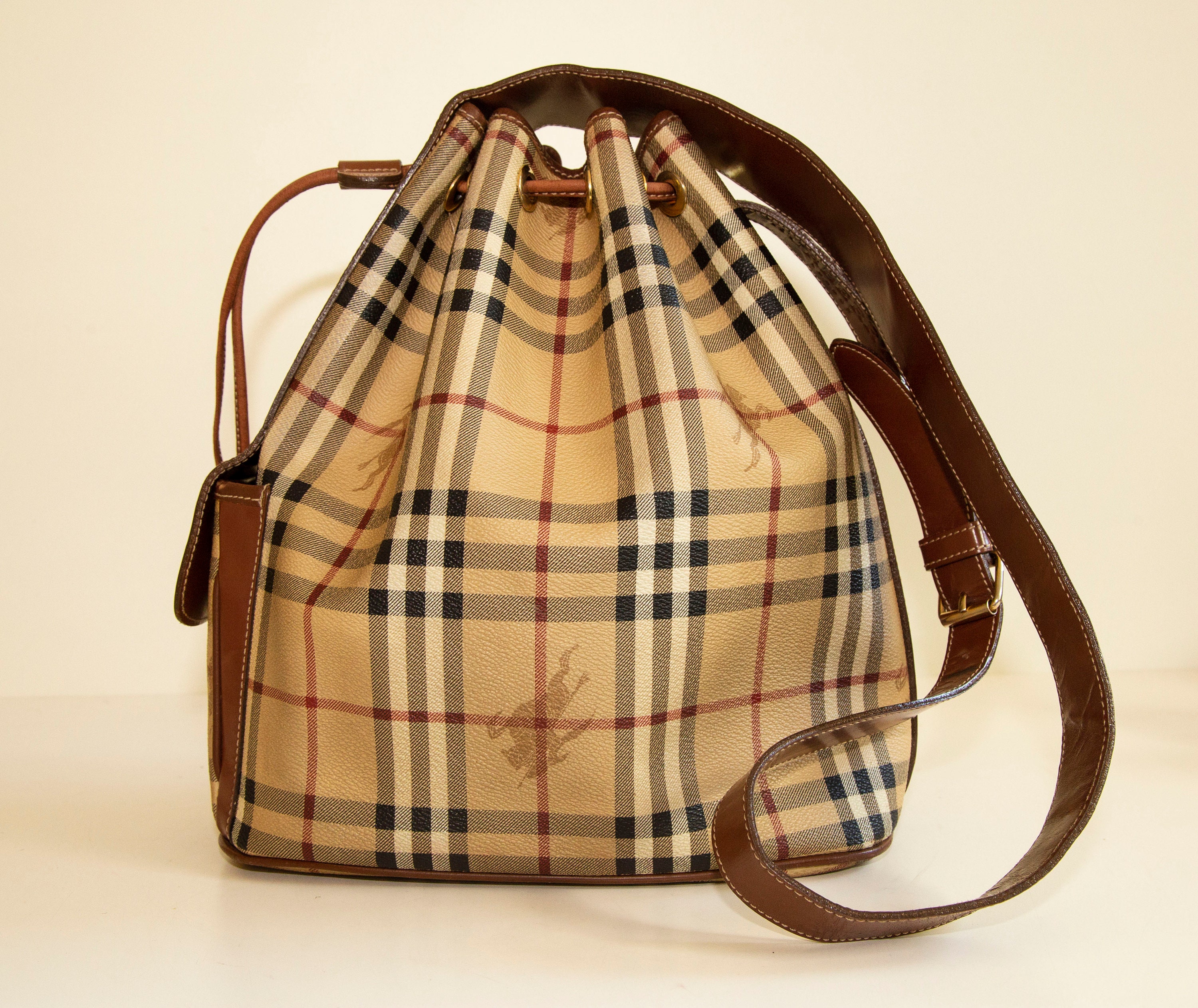 Burberry Leather-trimmed Checked Coated-canvas Bucket Bag in Brown
